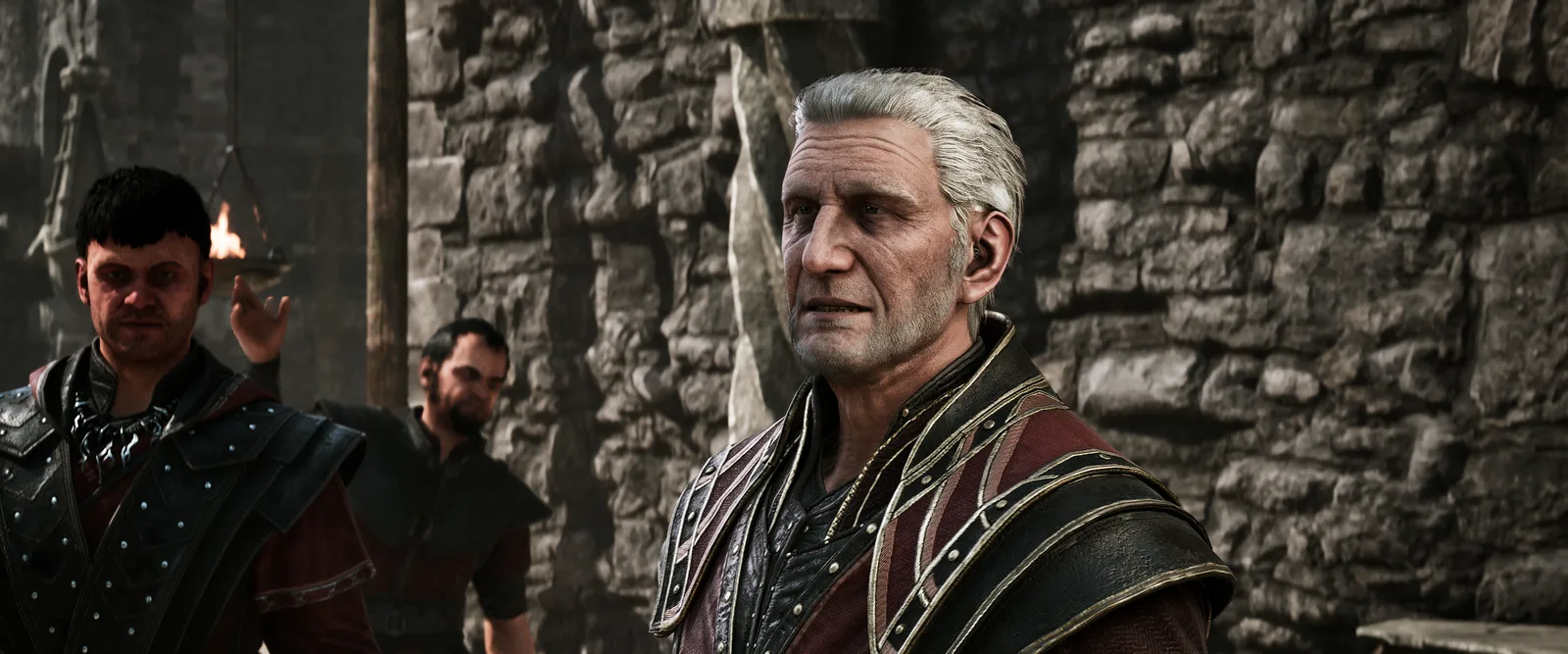 Corristo (rechts) mit einem jüngeren Magier vor einer Steinmauer, Gothic 1 Remake